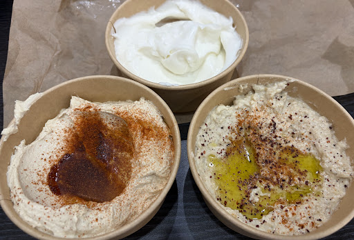 Hummus and baba ghanouj served with olive oil and spices